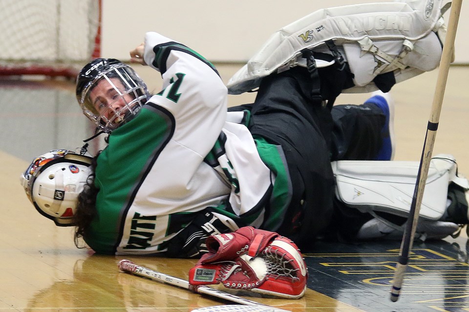 Team Prince Edward Island's Nathan Irwing, who scored the game-winner in overtime on Saturday, Feb. 29, 2020, hugs goaltender Keegan Waite after their gold-medal win at the 2020 Special Olympics Canada Winter Games. (Leith Dunick, tbnewswatch.com)