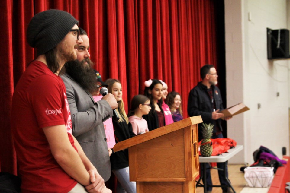 Wake the Giant organizers accepted the cheque at a DFC assembly.