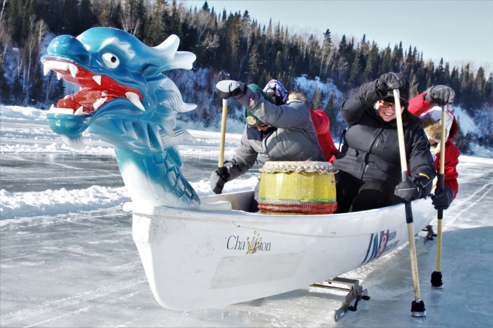 Staff at Fort William Historical Park demonstrate ice dragon boat racing, one of the many activities offered at the Voyageur Winter Carnival. (Photos by Ian Kaufman, tbnewswatch.com)