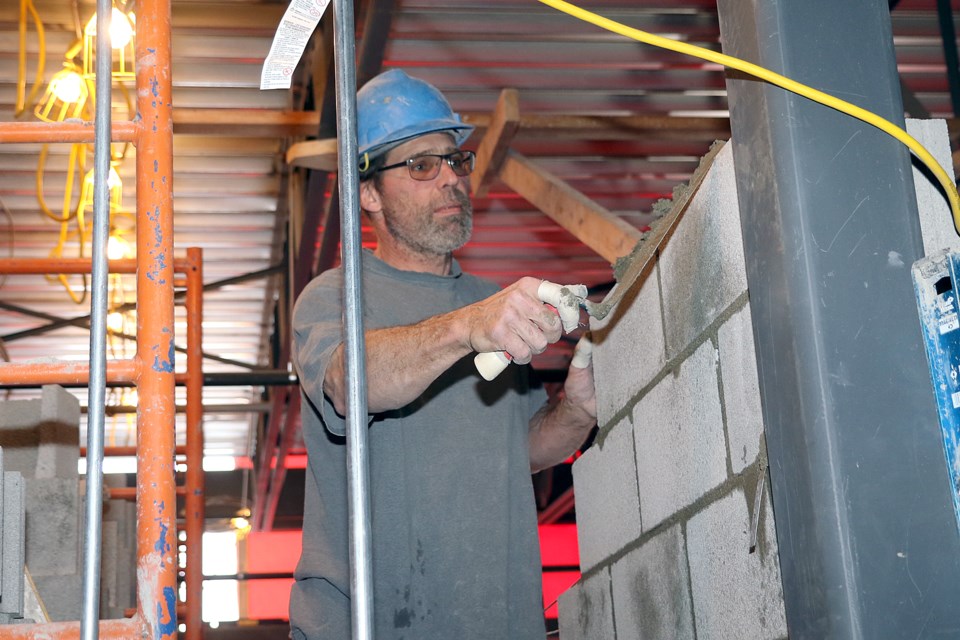 A worker does masonry work on Friday, Jan. 24, 2020 at Ecole Elsie MacGill Public School. (Leith Dunick, tbnewswatch.com)