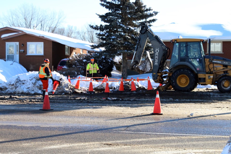 City crews continue to work at repairing a water main that broke early Monday morning. 