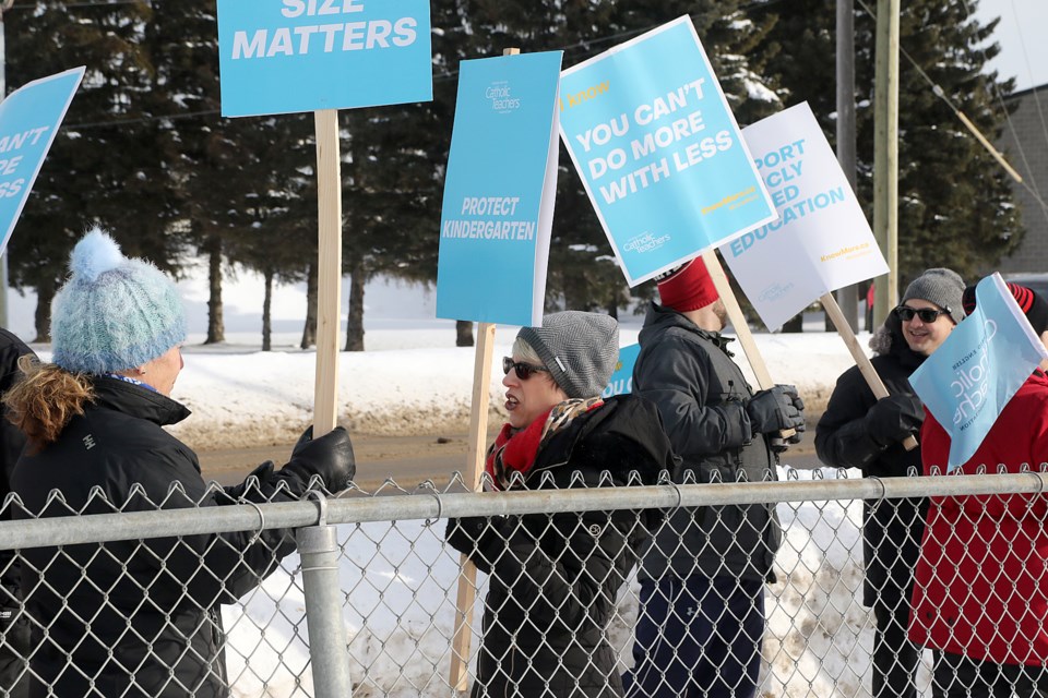 Ontario English Catholic Teachers' Association members picket on Tuesday, Jan. 21, 2020 in front of St. Bernard School in Thunder Bay, part of a one-day, province-wide strike. (Leith Dunick, tbnewswatch.com)