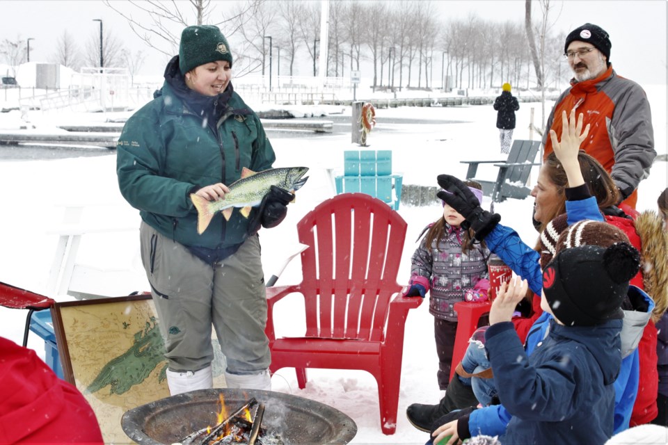 Parks Canada interpreter Sarah Rauh shares stories about Lake Superior with families at this Sunday's Winter FunDays event (Ian Kaufman, Tbnewswatch)