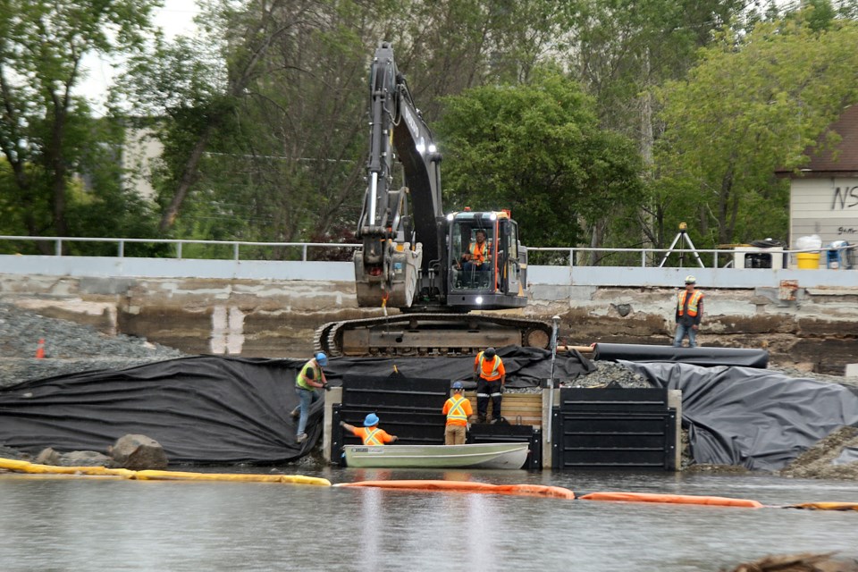 Repairs are made to the Boulevard Lake dam on Tuesday, July 21, 2020. (Leith Dunick, tbnewswatch.com)