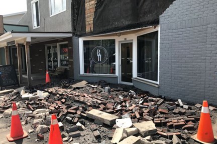 A brick facade above the Beauty House on Tuesday, June 16, 2020 came crashing down to the sidewalk. (Dan Cheal/submitted photo)