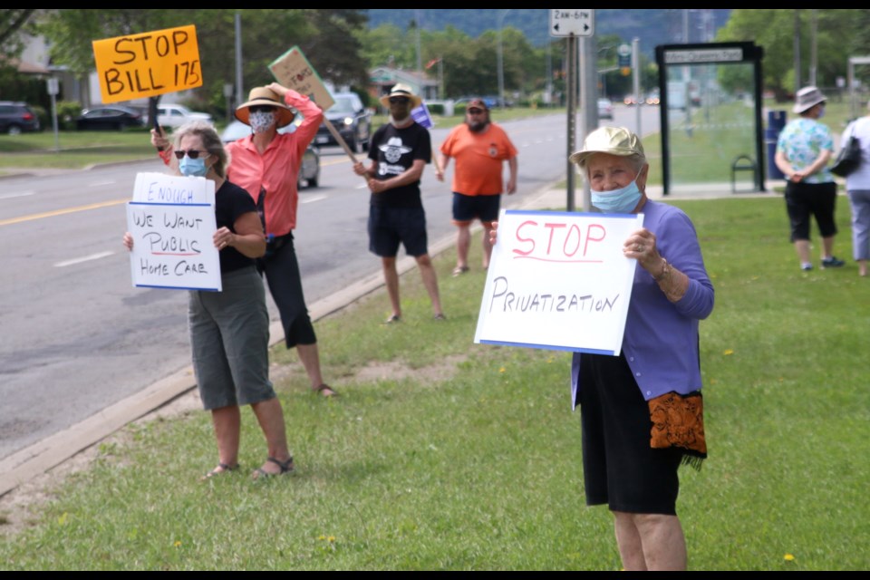 Several dozen people rallied outside Mini Queen's Park on Wednesday to protest Bill 175. (Photos by Doug Diaczuk - Tbnewswatch.com). 