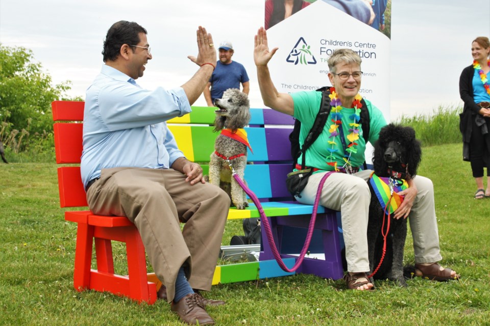 New Thunder Pride program manager Abhi Rao (left) and Children's Centre CEO Diane Walker give a socially distant high five. (Photos by Ian Kaufman, tbnewswatch.com)