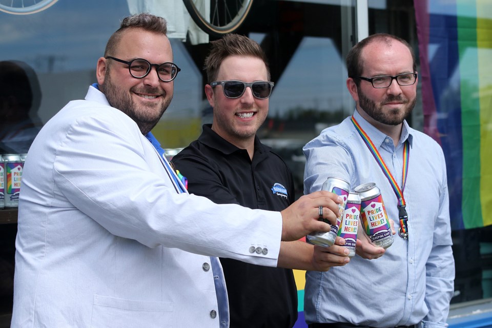 Kevin Brewer (centre), general manager at Sleeping Giant Brewery, on Wednesday, June 24, 2020 is joined by Thunder Pride chair Jason Veltri (left) and Borderland Pride co-chair Douglas Judson to launch Pride Lives Here beer. (Leith Dunick, tbnewswatch.com)