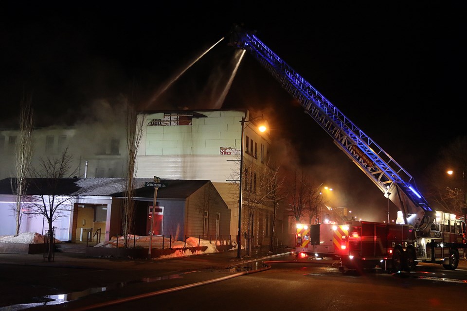 Firefighters battle a fire on Sunday, March 1, 2020 at the Odd Fellows Hall on May Street. (Leith Dunick, tbnewswatch.com)