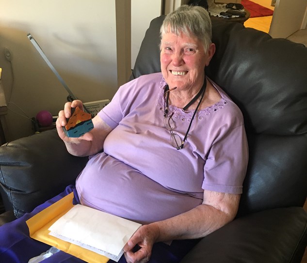 Mrs.Harriet Renaud, a resident at Chartwell Thunder Bay, holds up a painted rock by a student at McKenzie Public School. Reneaud is also a former teacher at McKenzie. (Photo supplied). 