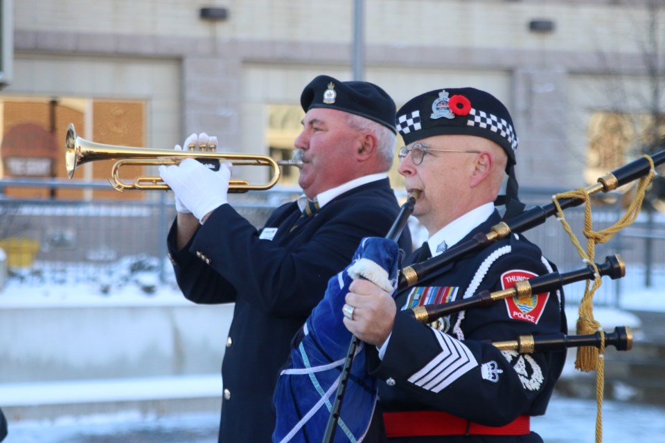 Ken Milenko (left) played the last post at a scaled down Remembrance Day ceremony on the city's south side. (Photos by Doug Diaczuk - Tbnewswatch.com). 