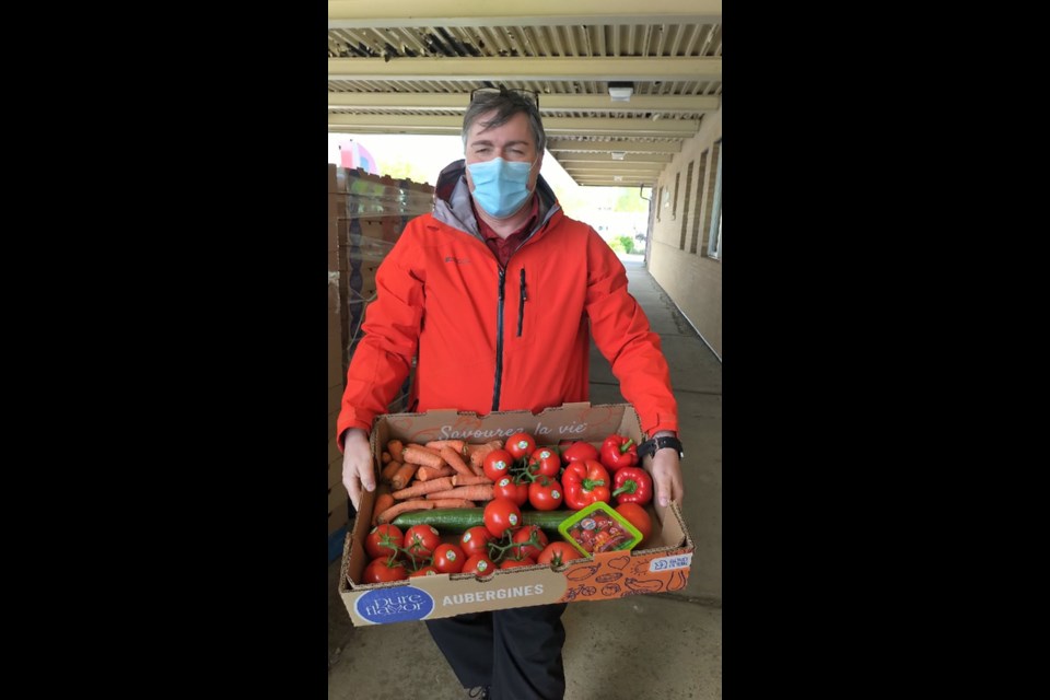 Wayne Vanderwees, the RFDA's logistics consultant, holds one of the hampers that arrived from southwestern Ontario (RFDA photo)