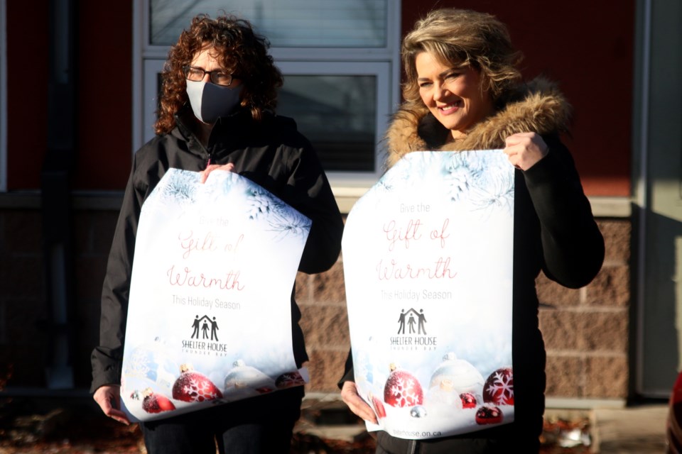 Shelter House board chair Wanda MacArthur and Shelter House executive director Michelle Jordan also launched the annual holiday fundraising campaign on Monday, the Gift of Warmth. 