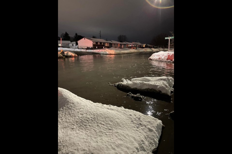 This photo taken at Redwood Ave. and University Dr. shows the flooding that happened Tuesday night after a watermain break (Facebook/RJ Riddell)
