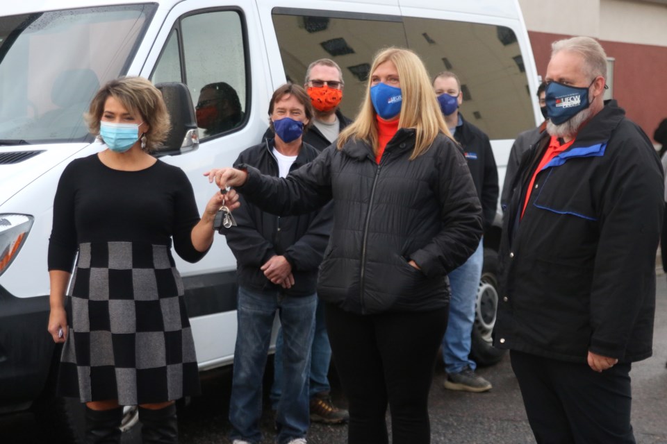 Kelly Tosato (middle), secretary-treasurer and Shawn Haggerty, president of UFCW Local 175 hand over the keys of the Mercedes sprinter van to Michelle Jordan, executive director of Thunder Bay Shelter House. (Photos by Doug Diaczuk - Tbnewswatch.com).  