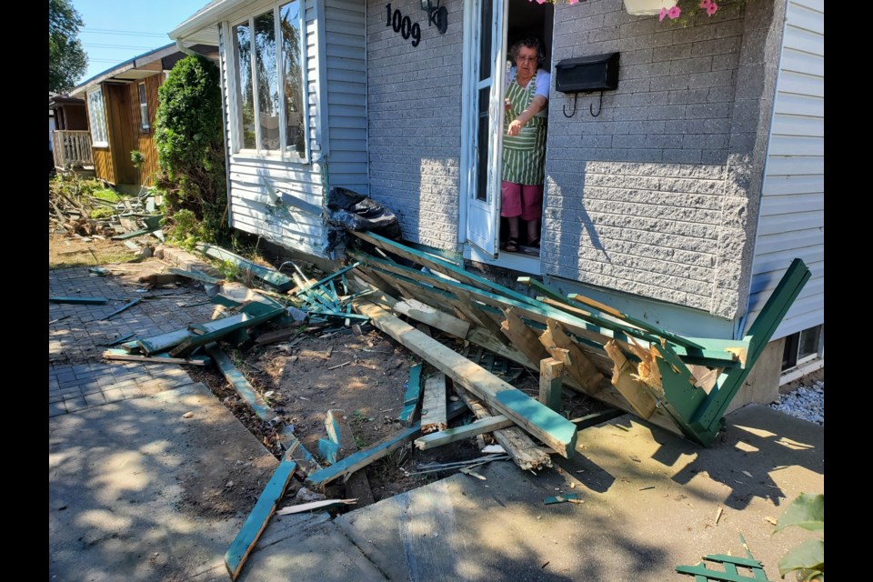 Tim ten Have's mother is shown inspecting the damage to her Ford St. home after an out-of-control car destroyed the deck on Aug. 23, 2021 (submitted photo)