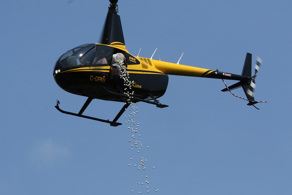 About 5,000 golf balls were dropped onto the 18th fairway at Whitewater Golf Course on Friday, Aug. 20, 2021, part of the Golf Balls from Heaven charity event. (Leith Dunick, tbnewswatch.com)