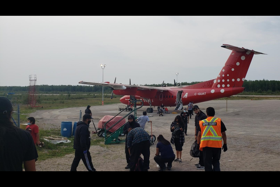 An aircraft returned evacuees who were staying in Sudbury to their home community of Pikangikum (Independent First Nations Alliance photo) 