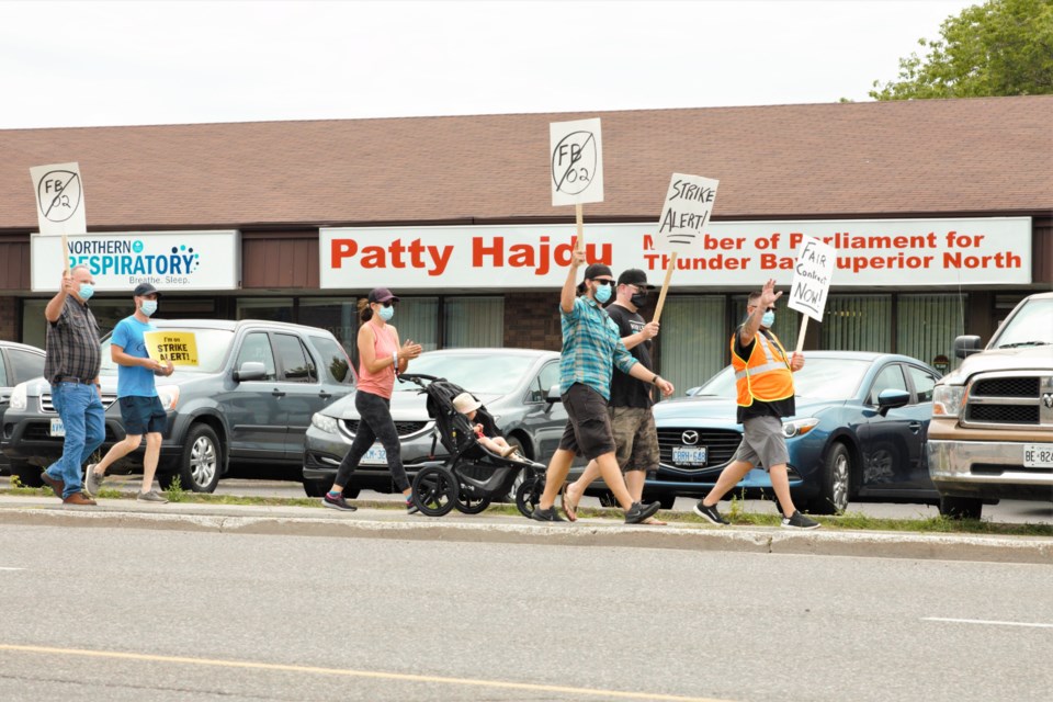Thunder Bay-area CBSA workers march in front of Patty Hajdu's office on Red River Road Thursday. (Photos by Ian Kaufman, TBNewswatch)