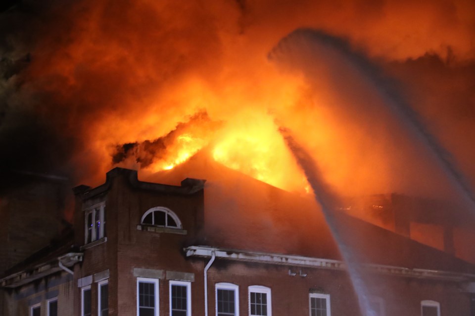 Firefighters battle a fire at the Finnish Labour Temple on Wednesday, Dec. 22, 2021. (Leith Dunick, tbnewswatch.com)