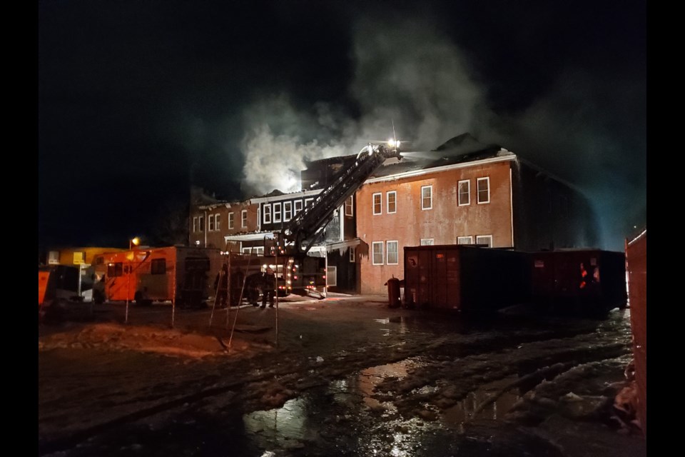 Firefighters continued to pour water on the roof of the Finnish Labour Temple just before dawn Thursday. Most of the roof was destroyed (Gary Rinne/TBNewswatch)