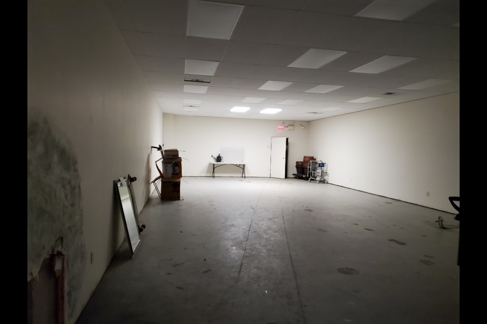 This is the empty store space beside the bank which the thieves apparently gained entry to.  The hole in the common wall with the bank can be seen in the lower left