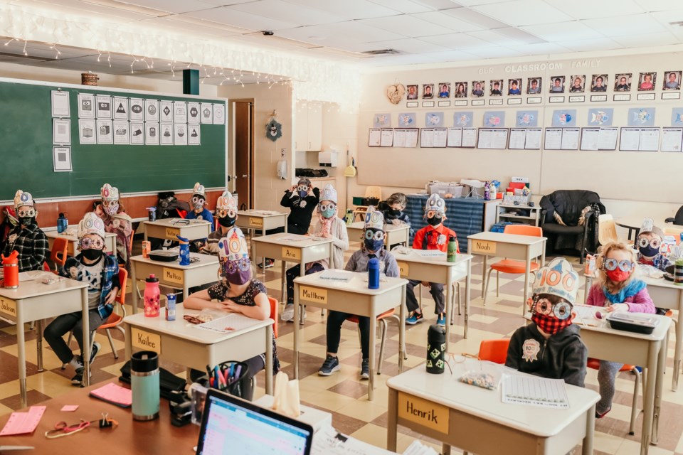 Grade 1 students at St. Pius X School take part in 100 Days of School celebrations, wearing masks, glasses and crowns. (submitted photo)