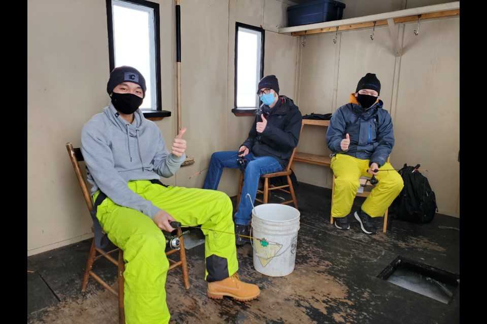 Second-year Culinary Management students, Tommy Nguyen, Justin He and Bryce Cunningham spent Thursday ice fishing. (Confederation College)