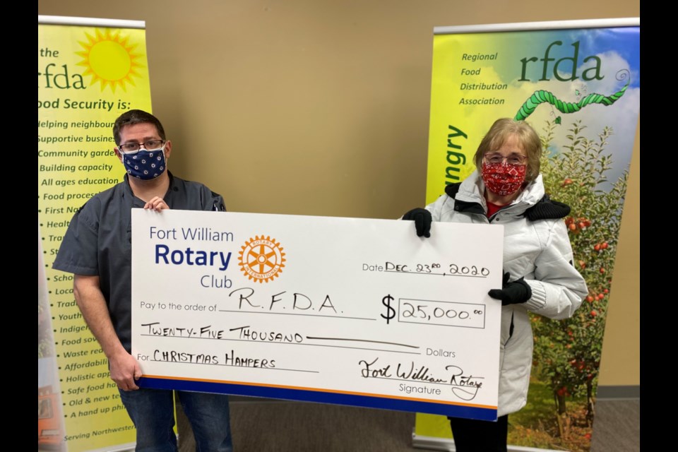 FW Rotary President Cynthia Judge presented a cheque for $25,000 to the Regional Food Distribution Association (RFDA).