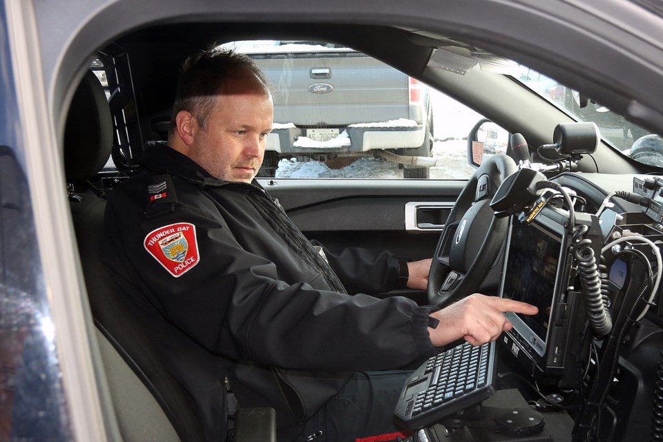 Thunder Bay Police Service acting traffic Sgt. Tom Armstrong on Tuesday, Jan. 5, 2021 tests out the traffic unit's new licence plate recognition technology. (Leith Dunick, tbnewswatch.com)