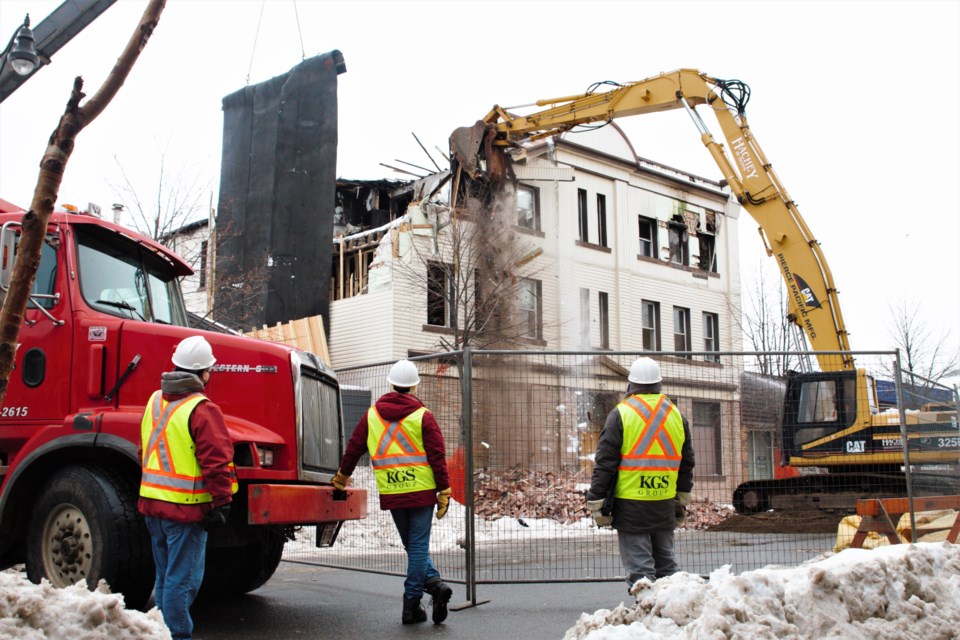 Workers demolish the former Oddfellows Hall on May Street on Saturday. (Photos by Ian Kaufman, tbnewswatch.com)