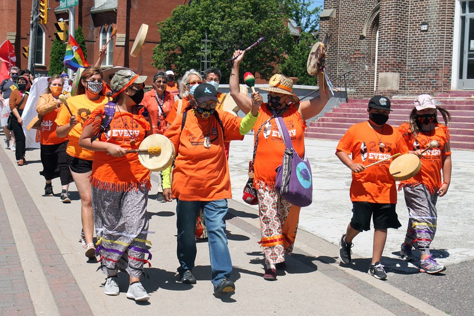 At least 450 people took part on Thursday, July 1 in the Anti-Canada Day rally, following the discovery of hundreds of bodies buried on the sites of former residential schools in Canada. (Leith Dunick, tbnewswatch.com)