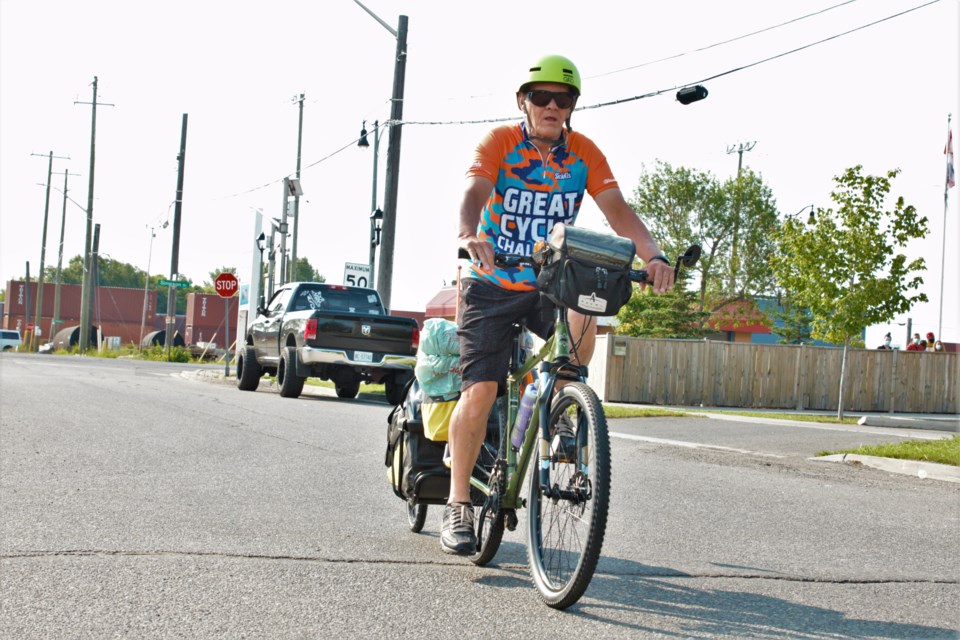 Martial Arbour was cheered on by a small crowd as he left on a 2,000-kilometre charity bike trip to Edmonton Friday. (Photos by Ian Kaufman, TBNewswatch)