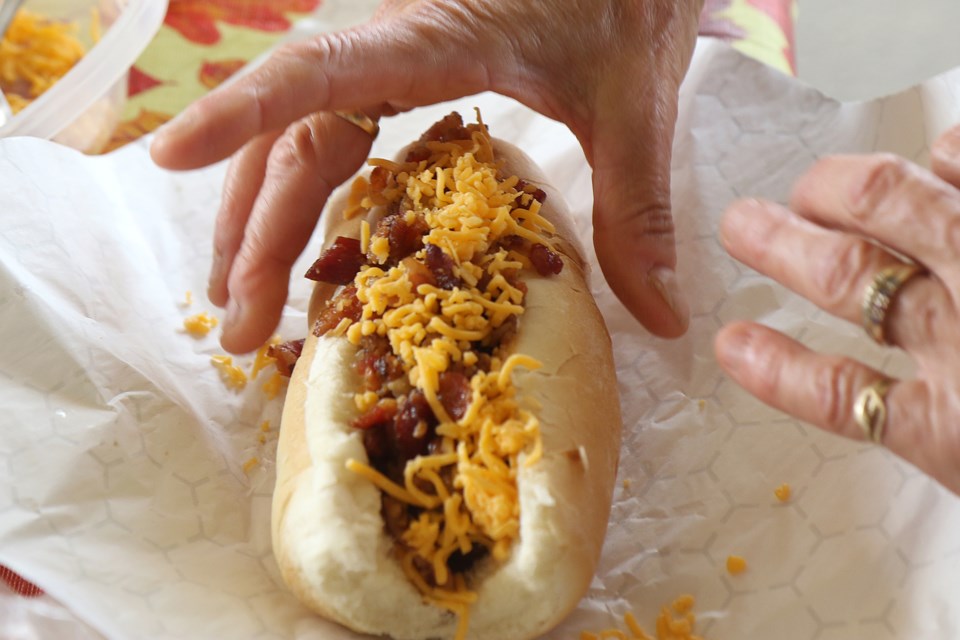 Dewie Dogs are on the menu on Thursday, July 22, 2021 at a fundraising barbecue at the Regional Food Distribution Association. (Leith Dunick, tbnewswatch.com)