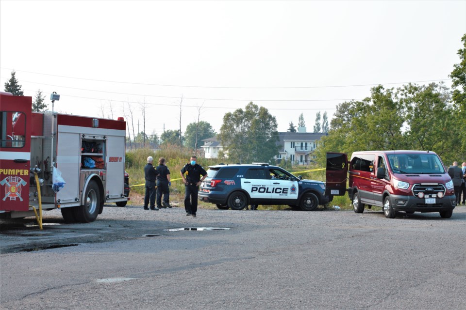 Emergency crews recovered a body from the Neebing River behind the Arthur Street Marketplace Tuesday. (Photos by Ian Kaufman, TBNewswatch)