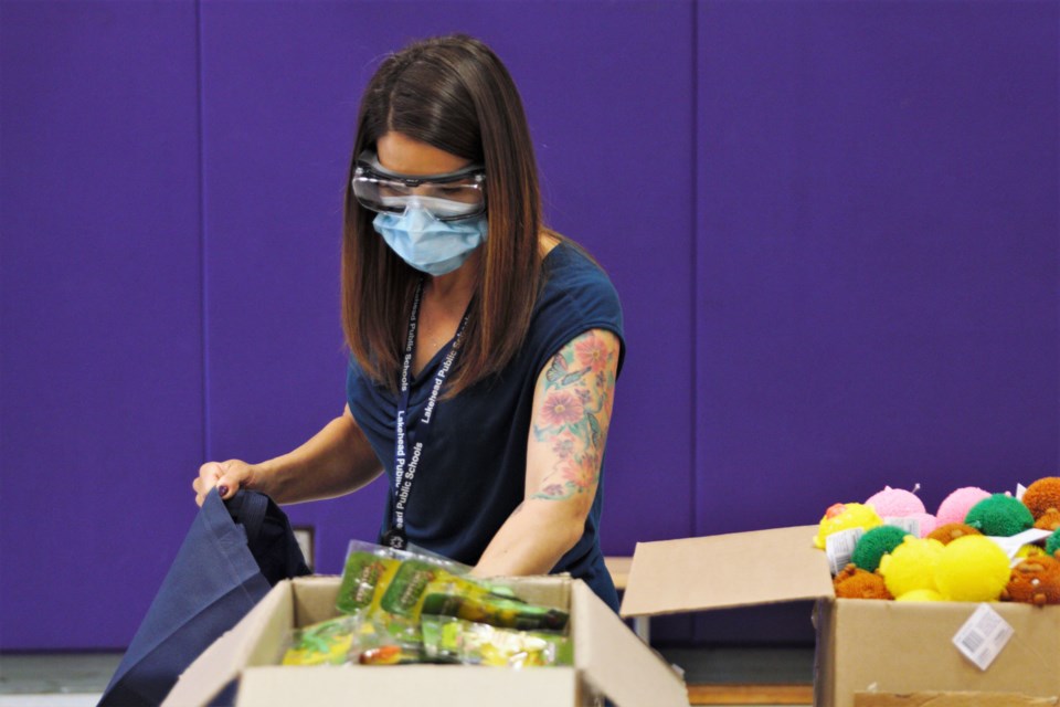 LDSB mental health lead Megan Tiernan helps pack calming kits at Claude E. Garton Public School on June 4, 2021. (Ian Kaufman, TBNewswatch)