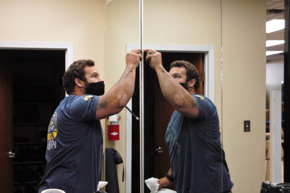 Andre Pellerin was one of more than a dozen tradespeople and other volunteers who helped refurbish the Underground Gym's new location Saturday. (Photos by Ian Kaufman, TBNewswatch)