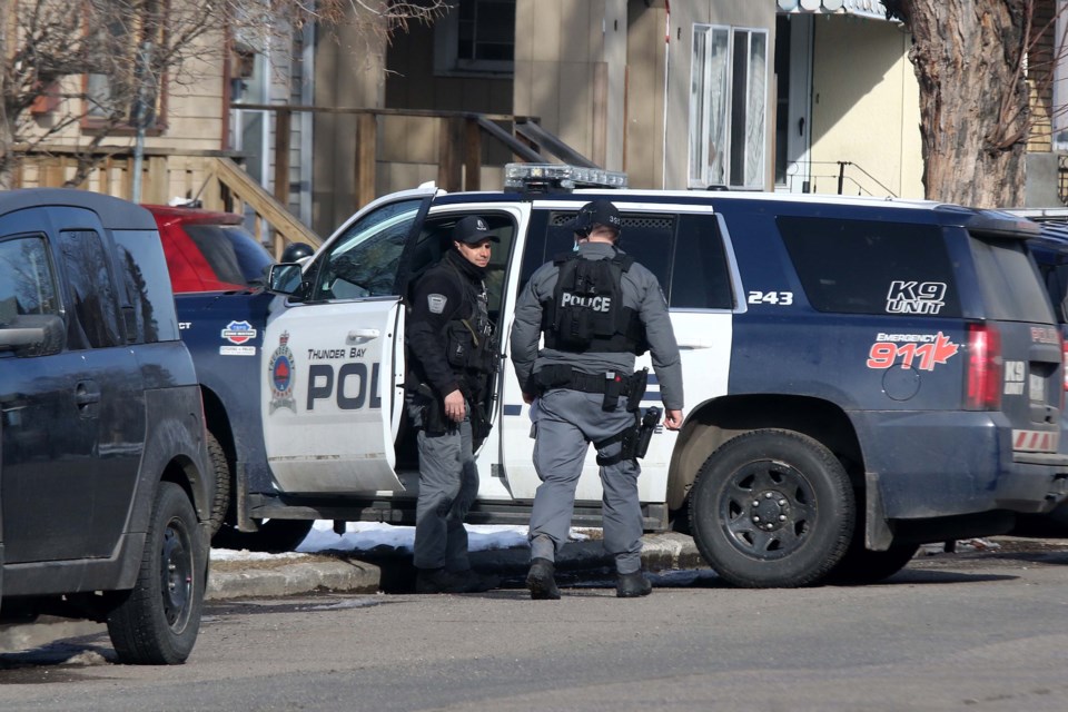A Friday night police standoff on Cumming Street was prompted by a weapons incident that caused serious injury. (Photos by Leith Dunick, tbnewswatch.com)
