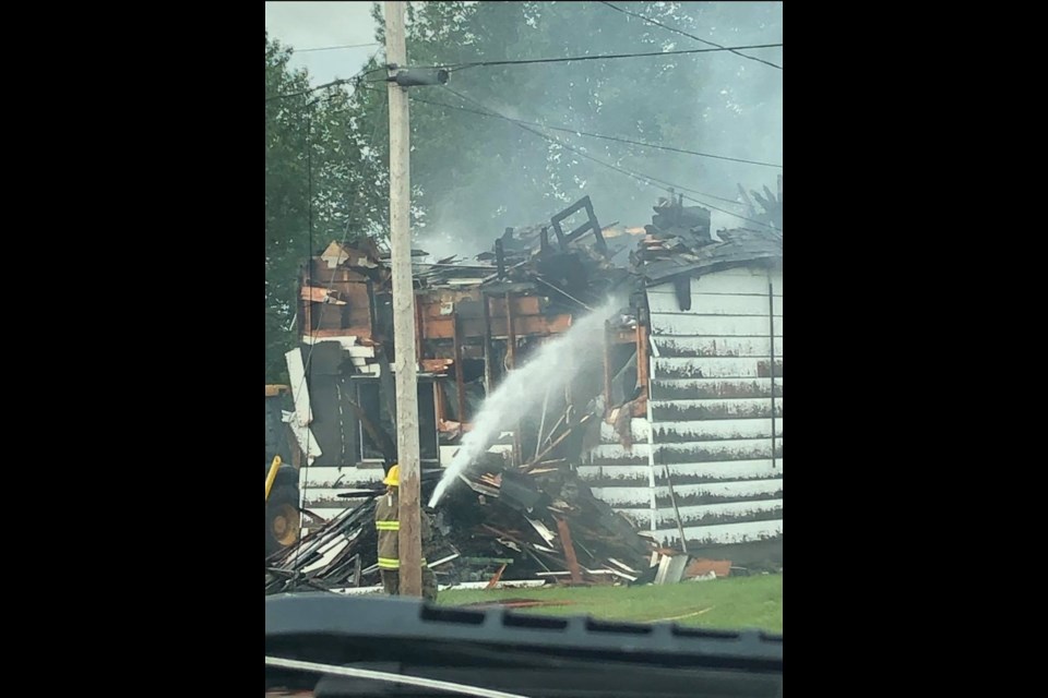 Firefighters douse a burning house in Nipigon on Jun. 20, 2021  (Facebook/Todd Childs)