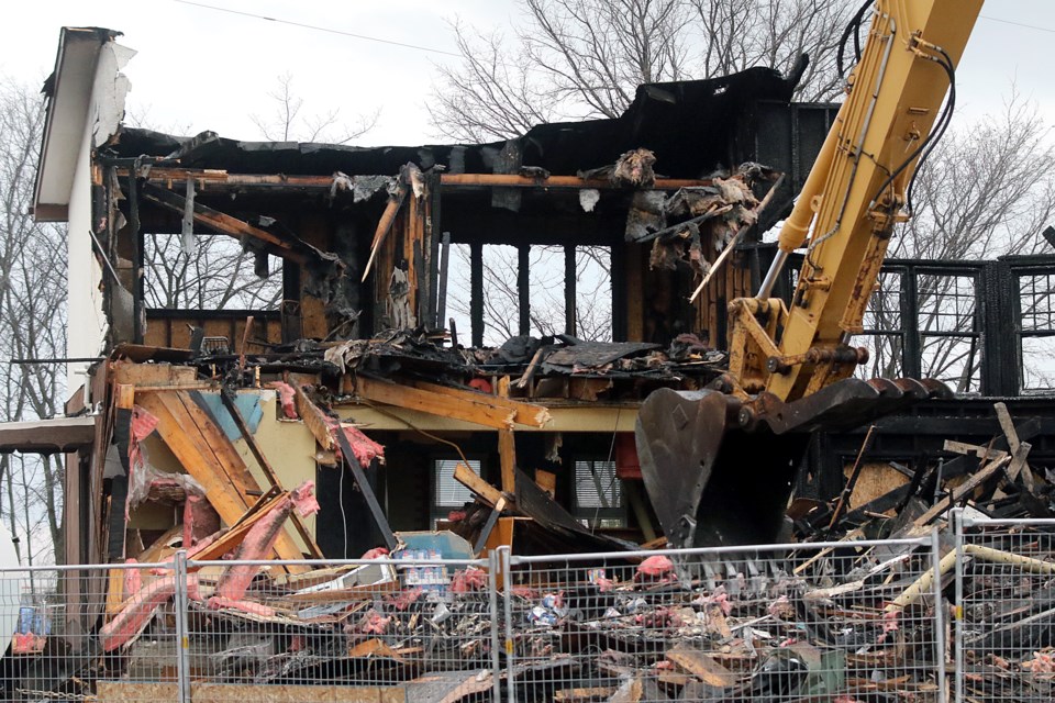 A demolition crew on Saturday, Nov. 6, 2021 tears down the iconic Caesar's Place restaurant, which burned down in July 2021. (Leith Dunick, tbnewswatch.com)