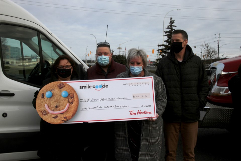 Geroge Jeffrey Children's Foundation presented with half the proceeds from the local Smile Cookie Campain