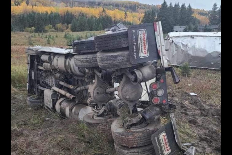 A tractor-trailer overturned after blowing past a stop sign at Sistonen's Corner, west of Thunder Bay, on Oct. 2, 2021 (Facebook/Skilled Truckers Canada)