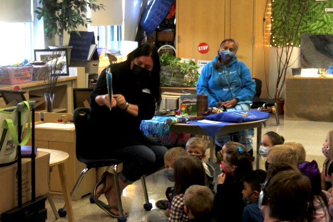 Lisa Harris reads the book "The Water Walker" to a kindergarten class