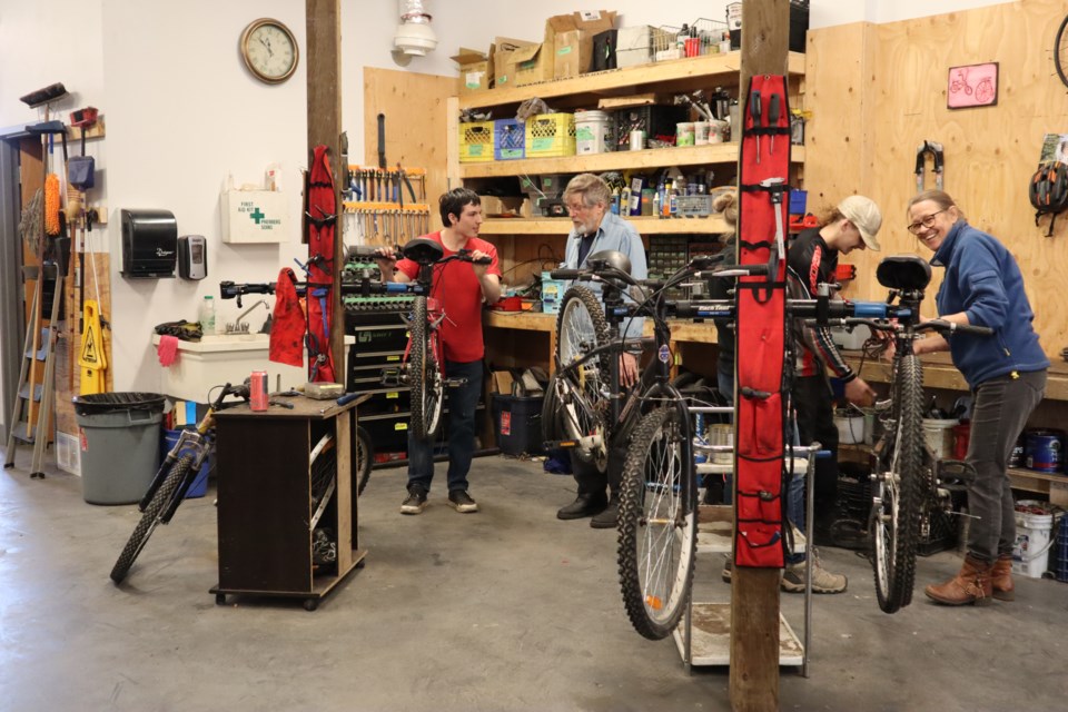 Beginner Bike Mechanic Workshop participants learn hands-on skills at Community Spokes (provided photo)