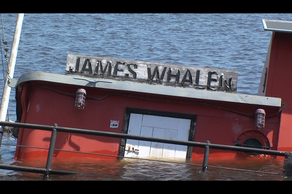 The historic tugboat James Whalen sank at its berth in the Kaministiquia River on May 1, 2022. (Vasilios Bellos/TBTV photo)