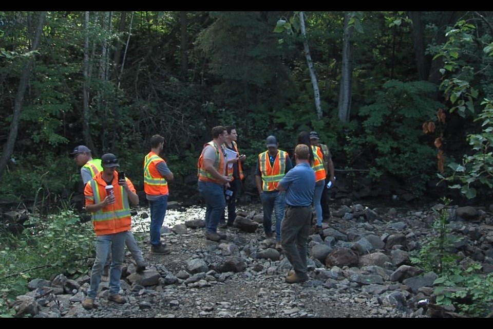 Companies interested in bidding to replace a culvert underneath River St. visited the site on Aug. 29, 2022 (Jessah Clement/TBTV photo)