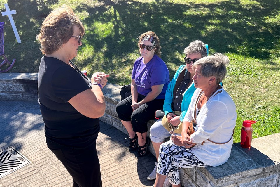 Carolyn Karle on Wednesday, Aug. 31, 2022 speaks to a group of women while marking International Drug Overdose Awareness Day in memory of her daughter Dayna, who died in October 2021. (Leith Dunick, tbnewswatch.com)