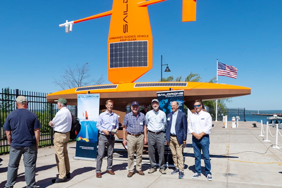 A celebration of advanced technologies on the Great Lakes hosted by USGS in Ashland, Wisconsin. From left, Josh Miller, USGS biologist, Congressman Tom Tiffany (WI-07), David Applegate, Associate Director for Natural Hazards at USGS, Russ Strach, Director for the USGS Great Lakes Science Center, Matt Womble, Saildrone director of ocean data programs. (Courtesy of Saildrone)