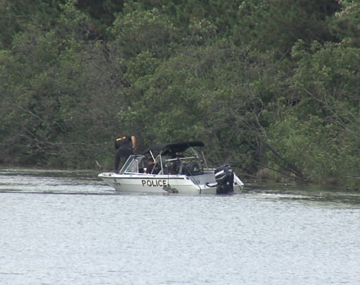 OPP officers in a boat were searching the Neebing-McIntyre Floodway on Aug. 17, 2022 (Jessah Clement photo)