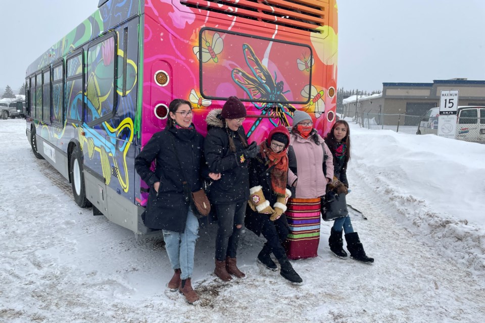 A few of the artists pose in front of the Maamawe Art Bus